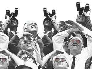 A group of people looking up to the sky