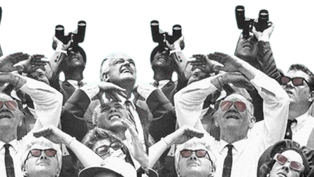 A group of people looking up to the sky 