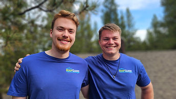 RoofGuard co-owners wearing branded company shirts in Northwest Washington.