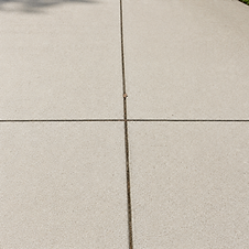 Clean concrete surface after professional soft washing and stain removal.
