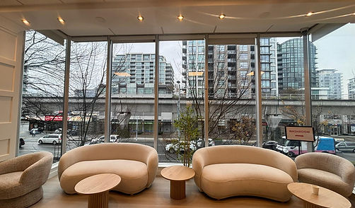 Renovated church lounge area with floor-to-ceiling windows, natural light, and modern seating following interior renovation.
