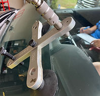 Windshield crack repair in progress using professional resin injection tools on a vehicle windshield in Edmond, Oklahoma