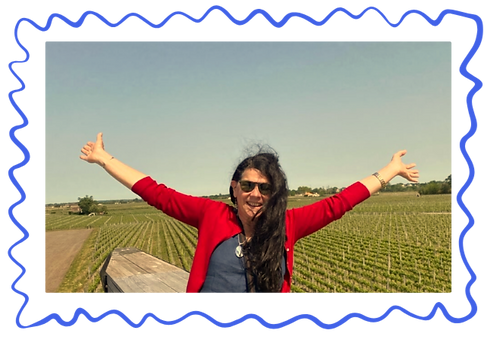 Reggie smiling in a vineyard