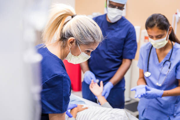Healthcare workers in emergency room with patient