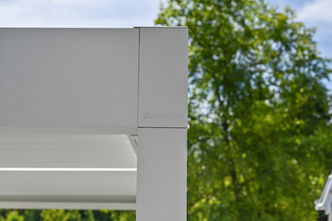 Outdoor living area featuring Renson pergola, Azek decking, and Feeney railing designed by OnDeck in Long Grove