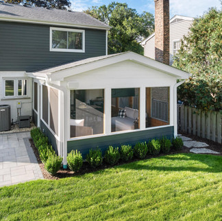 Screened-in porch with natural light and greenery
