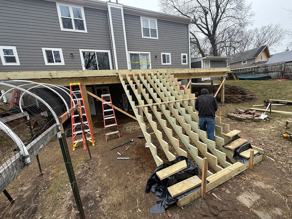 Deck framing showing structural joists and beam connections