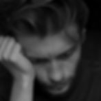 Grayscale Photo of Man Looking Problematic