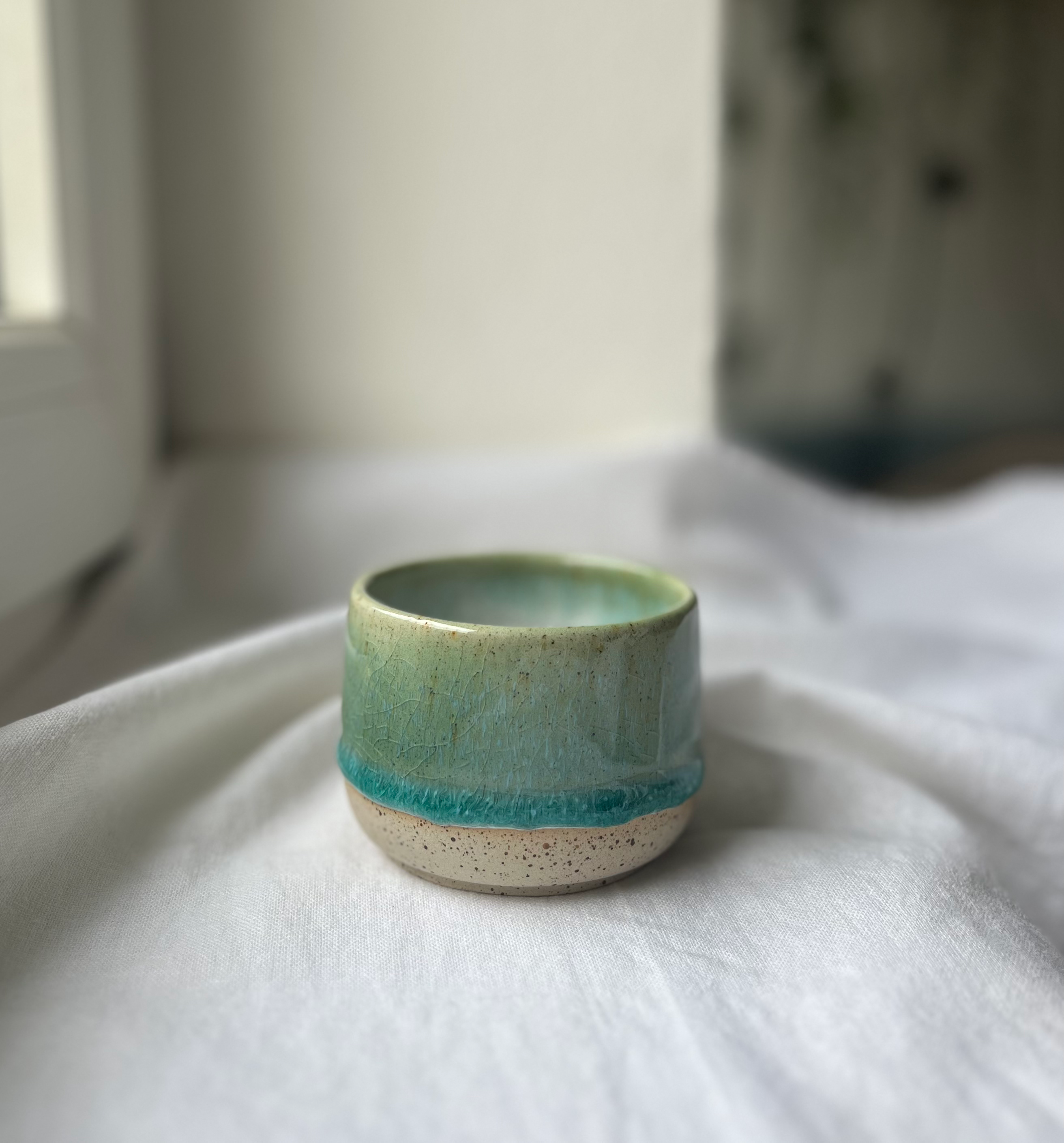 Speckled Rain and Oribe coffee cup