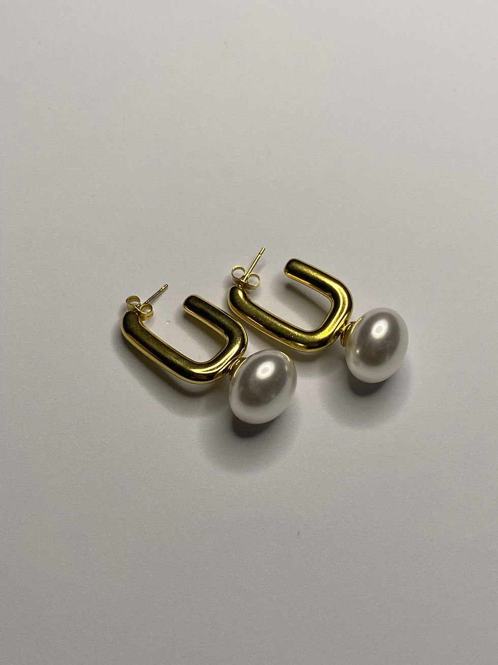 top inci sallantılı küpe