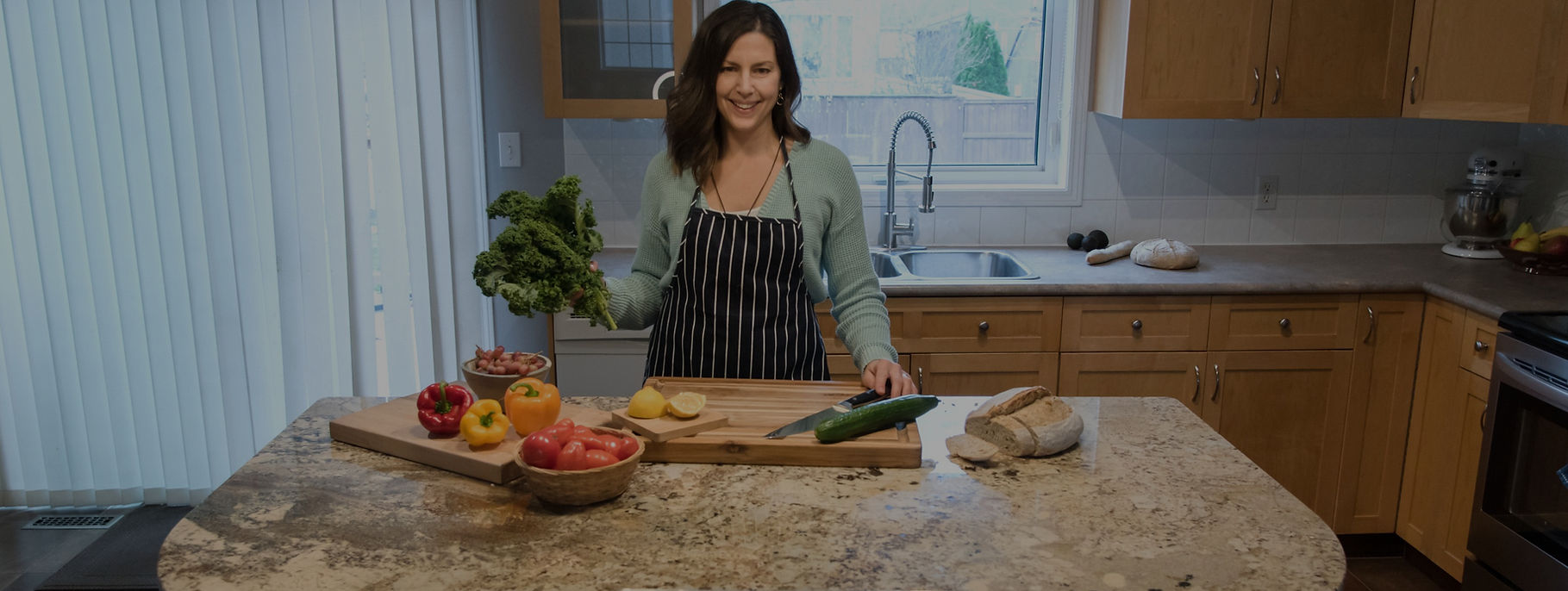 Janine of Real Life Nutrition cooking in her kitchen