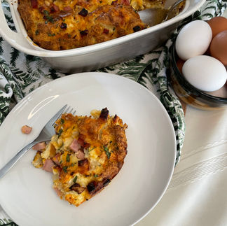 Egg Strata served on a white plate with a fork