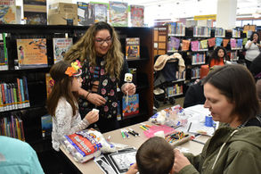 Past Midwest Mujeres Participant Gabby Tellez, at Sun Prairie Day of the Dead outreach