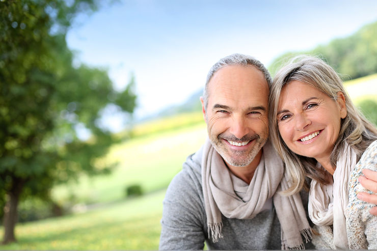 Smiling couple outdoors, used to illustrate Paragondental’s welcoming approach in Radlett.