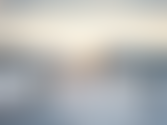 woman walking down fence-lined snowy path