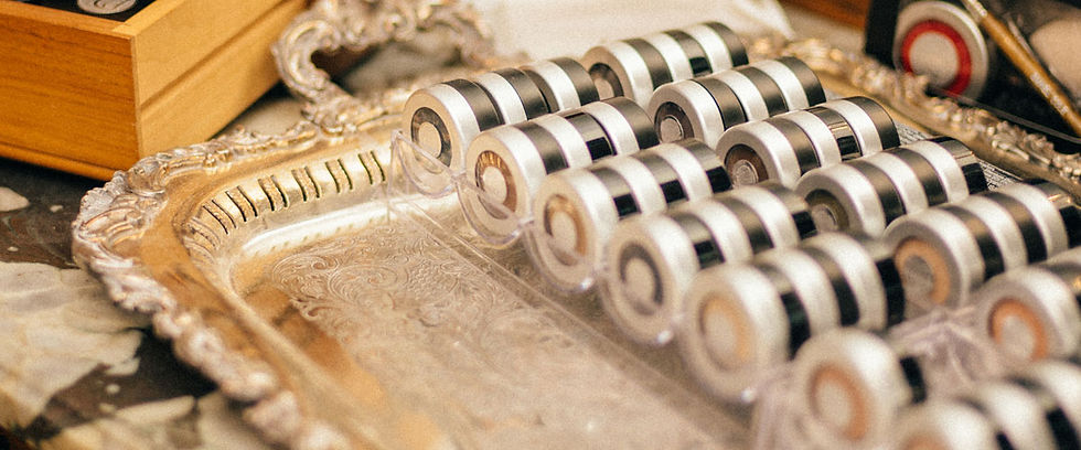 2.jElegant display of individually packed eye shadows in silver trays, showcasing a range of shades from the Daniel Cole Bepg