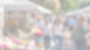 A bright outdoor market scene with small vendor tables, handmade items, flowers, and famil