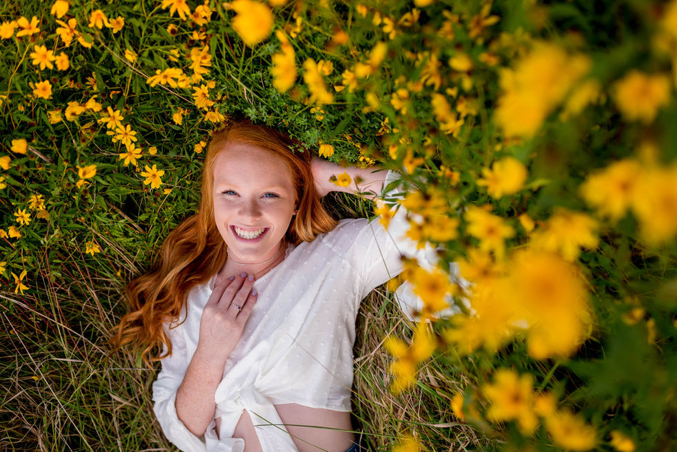 senior photography girl in flower filed