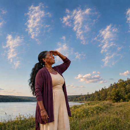 A curious Black grandmother gazes upward as seven grandfatherly faces emerge subtly from clouds above a lakeside meadow.