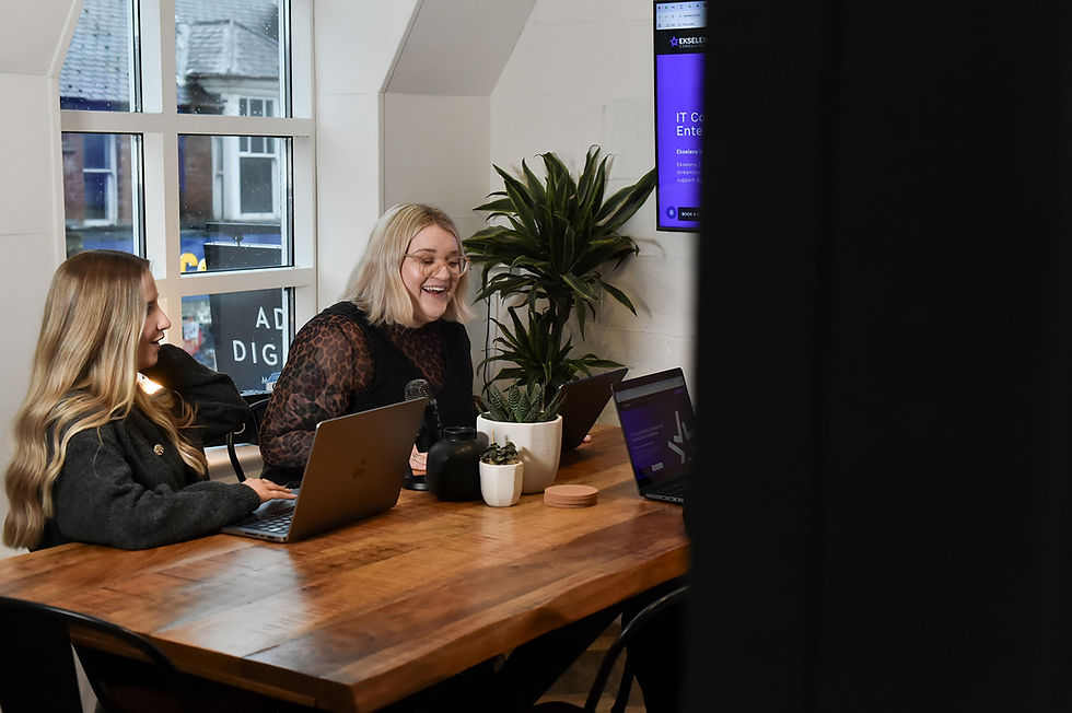 SEO manager Rosie talking to Scarlett our digital marketing exec at ADA HQ