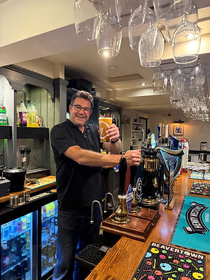 Andy behind bar September 2025.jpg