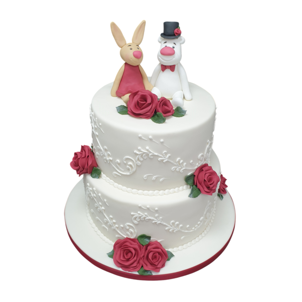 Two-tier wedding cake with sugar paste roses and character toppers.