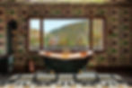 Copper bathtub in front of a large window with a view of green hills. Walls have a black and green geometric pattern. Cozy, rustic mood.