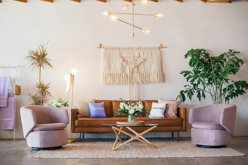Bohemian Interior Decorations with leather couch and pink swivel chairs