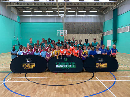 Primary school basketball festival benefits from COLBA Athlete involvement.