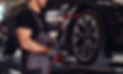 muscular-man-is-fixing-car-s-wheel-with-special-tool-auto-service.jpg