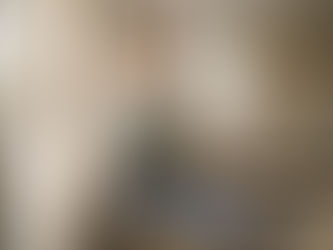 Painter taping window frame for safe home painting