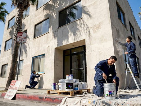Painters prepping LA office exterior morning