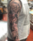 Religious black and grey sleeve by Erika Jurkovic.