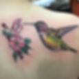 Humming bird with flower tattoo by Erika Jurkovic