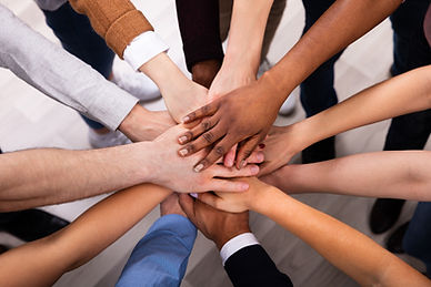 High Angle View Of Multiracial Friend Stacking Hand Together.jpg