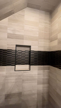 Floor to ceiling tile with bold accent strip