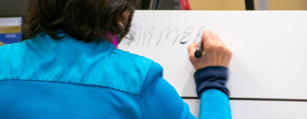 Local Ward 7 councillor Esther Pauls signs the Hate Free Zone poster.