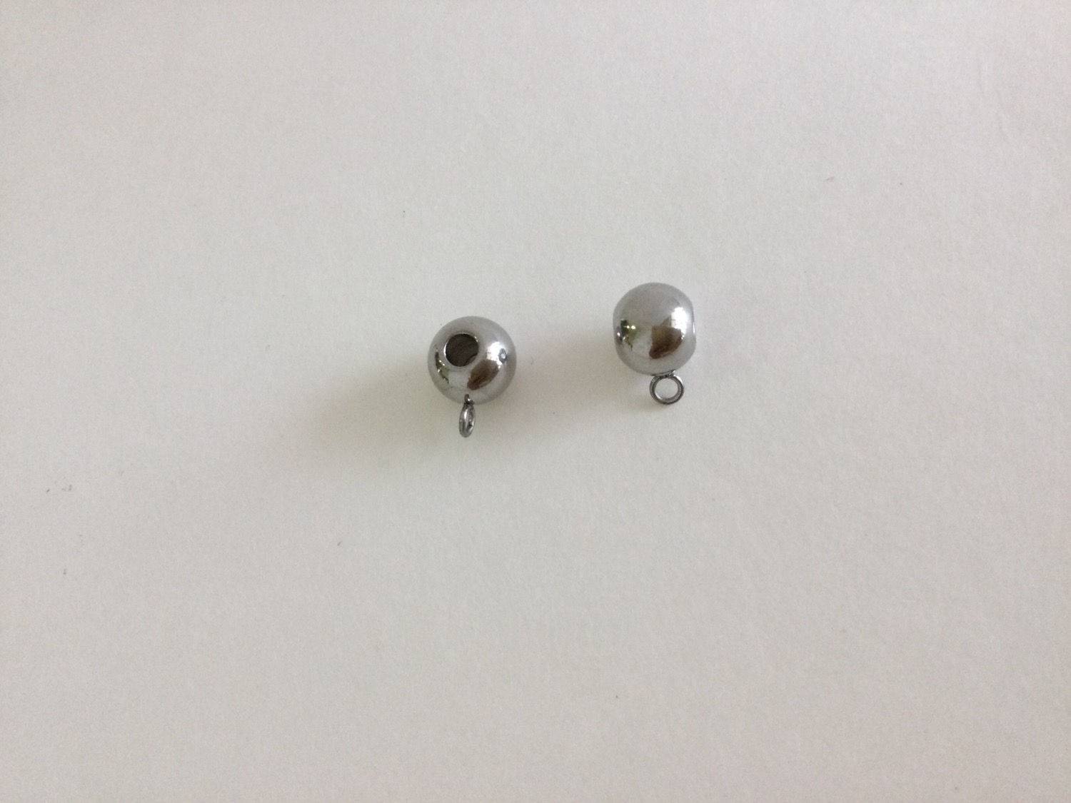 Charm holder 8mm stainless steel, sold by 10 or 50 pieces.