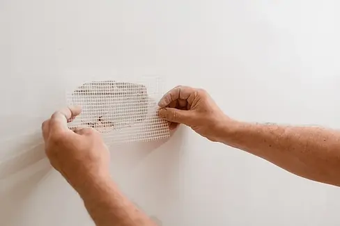 repairing-holes-drywall-hole.webp