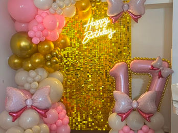 Pink and gold 17th birthday balloon decor with shimmer wall by ABI DECOR.