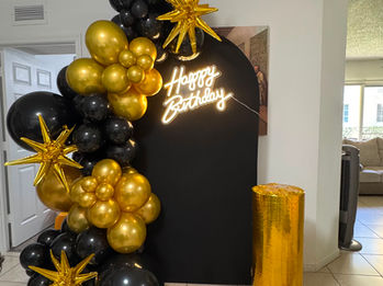 Black and gold luxury birthday balloon backdrop by ABI DECOR Florida.