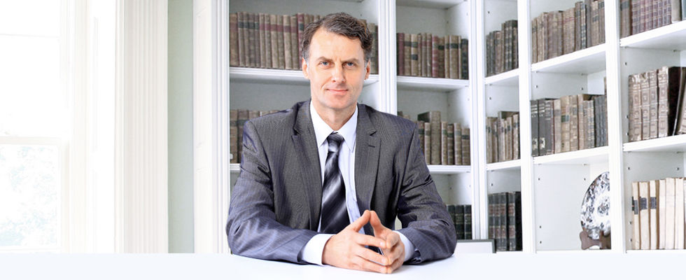 Man in suit sitting at desk