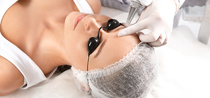 Young woman undergoing laser removal of permanent makeup in salon. Eyebrow correction.jpg