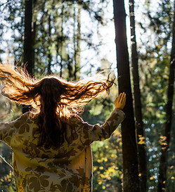 young-woman-with-long-red-hair-linen-dress-gathering-mushrooms-forest.jpg