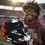 Thumbnail: Fan posing with football helmet prop