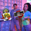 Thumbnail: People posing with Rock & Roll record, and Retro Video Game Controller props