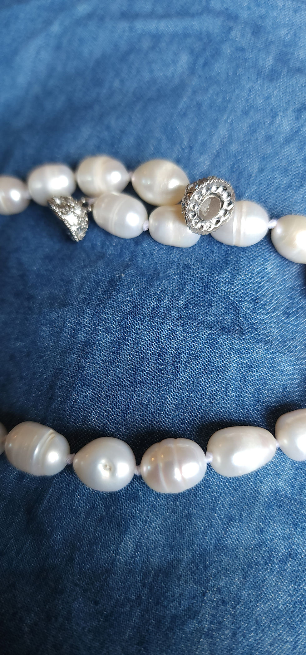 White pearl necklace with silver clasps on blue background, The Admiral's White South Sea Pearl Set by Pirate Jewelry Co.