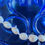 Thumbnail: White pearl necklace close-up on a blue decorative background Joyerías Nuñez