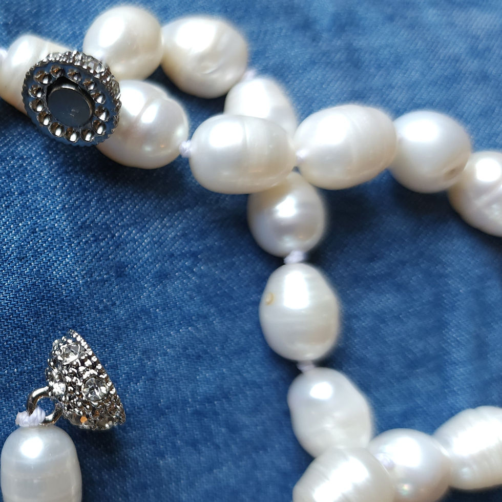 Thumbnail: Close-up of white pearl necklace, earring, The Admiral's White South Sea Pearl Set Joyerías Nuñez.
