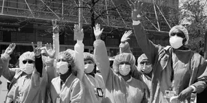 Explanatory Photo:
"Self Explanatory" 
This photo shows what looks like healthcare workers protesting during COVID. 